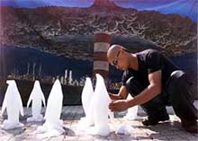 Korean environmental artist Choi Byung-Soo carves ice penguins