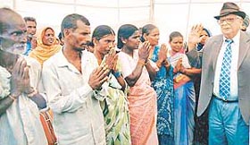 HOW ARE YOU? The UT Administrator, Lieut-General J.F.R. Jacob (retd), interacts with labourers at the opening of a bridge in Chandigarh 
