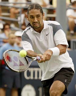 Marcelo Rios of Chile returns to Jonas Bjorkman of Sweden during their match at the US Open