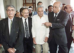 Lawyers of former Pakistan Prime Minister Benazir Bhutto leave a court in Karachi on Tuesday