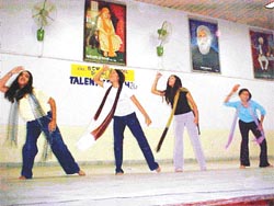 Students of BCM School present a dance during a talent-search contest