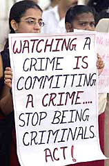 Activist holds placards during a protest