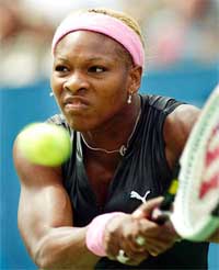 Serena Williams returns a shot to Dinara Safina of Russia