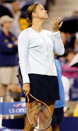 Lindsay Davenport of the USA feels for rain drops