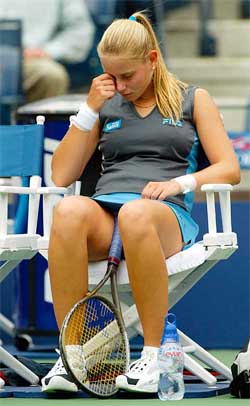 Jelena Dokic of Yugoslavia sits during her loss to Elena Bovina of Russia
