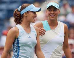 Switzerland's Martina Hingis and Russia's Anna Kournikova talk on Wednesday during their doubles match