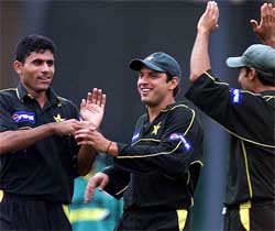 Pakistan's Abdur Razzaq, Shahid Afridi and Imran nazir celebrate after bowling out Kenya's batsman