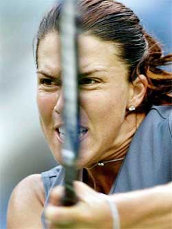 Jennifer Capriati of the United States follows through on a shot