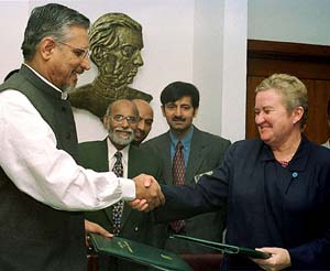 US Ambassador to Pakistan Nancy Powell shakes hand with Pakistan's Economic Affairs Secretary Waqar Masood 
