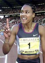 US triple Olympic champion Marion Jones raises his finger