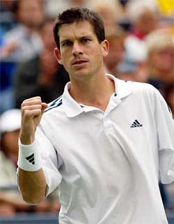 Tim Henman of Great Britain celebrates a point against Dick Norman