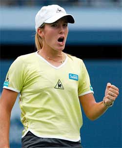 Justine Henin of Belgium celebrates a point against Bea Bielik 