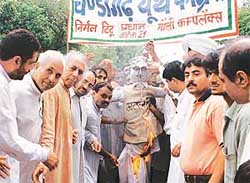 Congress activists led by the CTCC president, Mr B.B. Bahl, hold a rally in Chandigarh