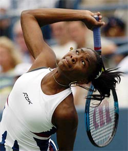 Venus Williams of the United States serves to Martina Muller 