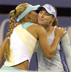 Anna Kournikova of Russia and her doubles partner Martina Hingis