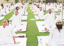 Members of the Bharatiya Yog Sansthan participate in a special yoga camp
