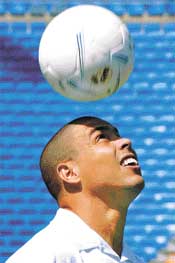 Real Madrid�s new Brazilian star Ronaldo heads the ball during his presentation ceremony at Santiago Bernabeu stadium