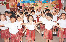 Students of Strawberry Fields Kindergarten sing delighful songs of innocence on the opening day of their music morning in Sector 24 on Tuesday.