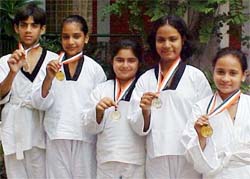 Karate players of KVM show their medals