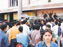 School students jostle for the tickets of the controversial adult film �Ek Chotti Si Love Story� 