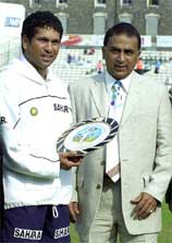 India's Sachin Tendulkar  receives a memento from Sunil Gavaskar