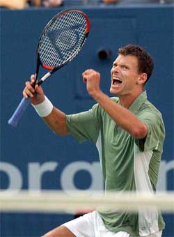 Sjeng Schalken of the Netherlands celebrates his win over Fernando Gonzalez 