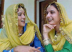 Two students supporting traditional Punjabi dress sing songs during a programme organised at SSD Girls College Bathinda on Saturday in connection with Teachers Day
