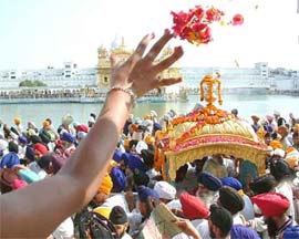 A devotee showers flowers