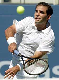 Pete Sampras of the United States returns to Sjeng Schalken of the Netherlands