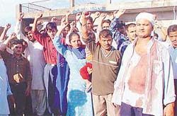 The victim, Naseer Singh, and residents of Nayagaon protest outside Nayagaon police station on Sunday