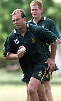 South Africa's Jacques Kallis bowls as captain Shaun Pollock looks on during a practice session in Colombo