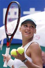 Russian tennis star Anna Kournikova gives away signature tennis balls after winning her match