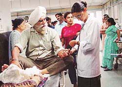 A city-based lawyer, Mr S.K.S. Bedi, accompanied by his wife being examined by a doctor at the GMCH, Chandigarh