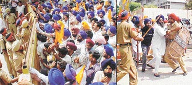 SAD activists being stopped by the police at the entrance to the mini-secretariat; and a scuffle between policemen and protesters