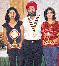 Dr G.S. Kochhar, president, Rotary Chandigarh Shivalik, flanked by Irina Brar (left) and Khushboo