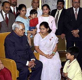 Prime Minister Atal Behari Vajpayee with family members of Indians