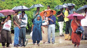 Some bellyache about inclement weather, others seem to be on cloud nine, bringing out colourful brollies