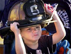 Parker Pearman, 2, wears his father's helmet