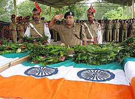 A BSF official pay tributes to killed security men