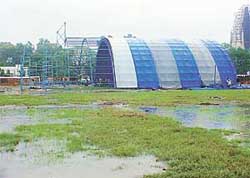 Tents erected for the National Handicraft, Culture and Food Festival inundated in rainwater at Government College for Women