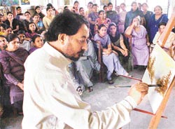 Mr Ravinder Sharma gives a demonstration to students of fine arts of the Khalsa College for Women