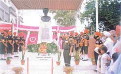 A guard of honour of 132 Infantry Battalion (TA) presents arms at the Saragarhi Memorial