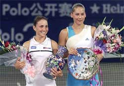 Top seed Anna Smashnova of Israel celebrates with Russian star Anna Kournikova