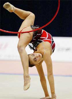 Alina Kabaeva of Russia performs with a hoop