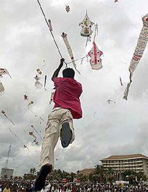 A Sri Lankan boy is lifted into the air