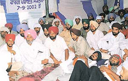 Terminated members of the Panchayat Secretaries Union stage a dharna at Sector 17 on Monday