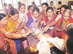 Devotees put �Puran Ahuti� on �Sugandh Dashmi Mahaparav� celebrated at Shri Digamber Jain Temple in Sector 27, Chandigarh, on Monday.