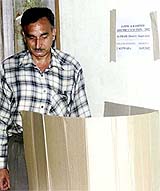 A Kashmiri migrant casts his vote at Jammu and Kashmir House in New Delhi on Monday