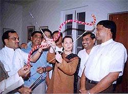 Congress President Sonia Gandhi tries her hand at the bow and arrow