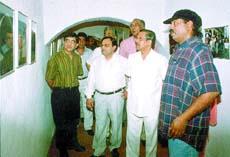 Delhi Police Commissioner R S Gupta appreciating a photo exhibition